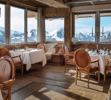 ALT="La Maison des Bois restaurant with alpine view"